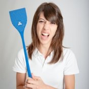 Furious girl with a fly swatter.