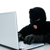 Preventing Identity Theft, Thief in mask on Computer