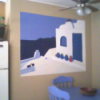 A white and blue mural painted on a kitchen wall.