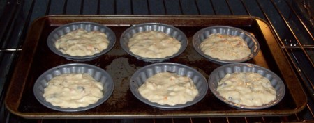 Muffin tops right after being placed in oven.