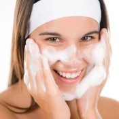 Preventing Acne, Young Woman washing her face