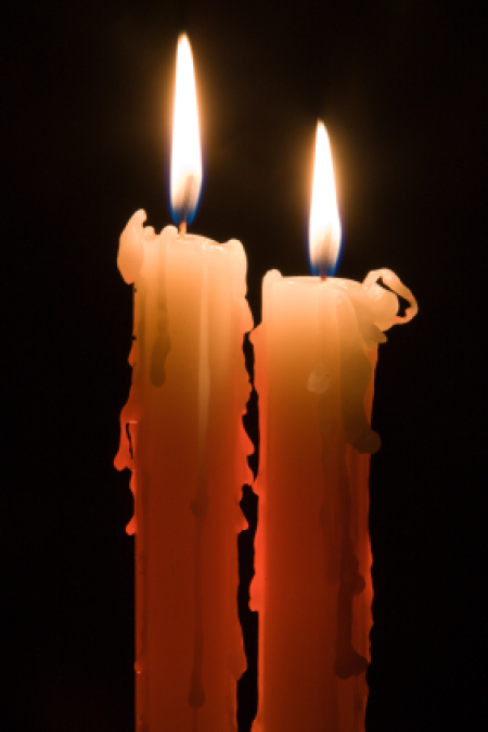 Two Lit Candles in the Dark