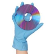 Hand with rubber glove holding a DVD