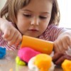 Girl Playing with Colorful Playdough