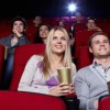A Couple Enjoying Popcorn and a Movie in the Theater
