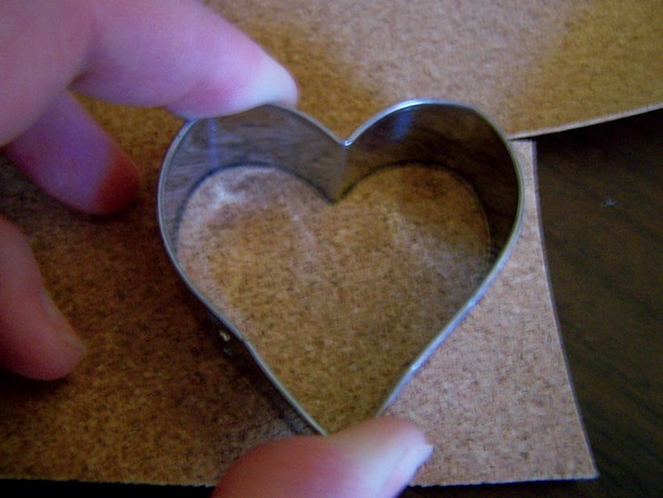 small metal heart cookie cutter placed on top of cork