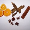 Dried oranges, cinnamon sticks, star anise, dried cinnamon flowers