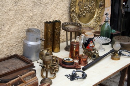 A table filled with antique nicknacks.