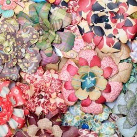 Paper flowers made with multicolored and patterned papers.