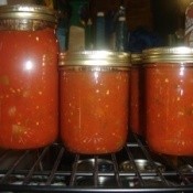 Jars of homemade canned tomato salsa.