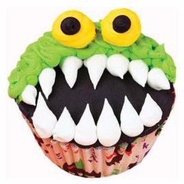 Monster cupcake with it's mouth open wide.