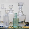 A collection of antique glass bottles.
