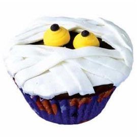 Mummy cupcake with yellow eyes.