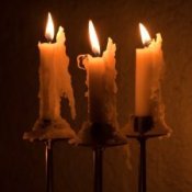 Candlesticks with melting candles on them.