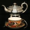 Cleaning Silver, Silver tea pot with an antique Chinese tea cup and saucer.