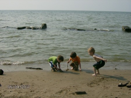 Three Young Boys Playing on Beach