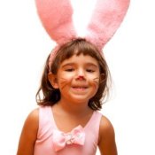 Young girl in a pink bunny costume.