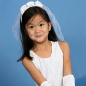 Little girl in a bride costume.
