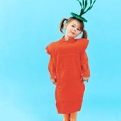 Young girl in a carrot costume.