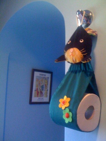 Hanging bunny toilet paper holder.