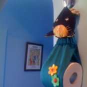 Hanging bunny toilet paper holder.