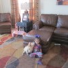 Sugar the Dog sitting on Floor With Little Girl