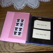 Brag book organizer with postage stamps in one sleeve.