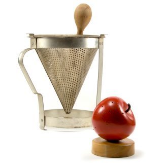 Seive and apple in preparation for making sauce.