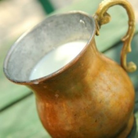 Buttermilk in a metal cup.