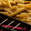 Pan of french fries in the oven.