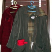 Two jackets hanging from unit.