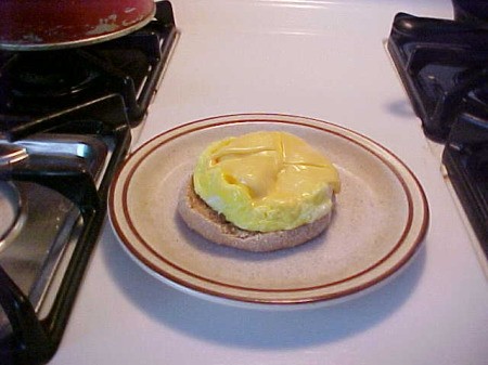 Finished McMuffin on a plate.