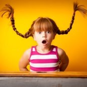 Young girl with red braids sticking straight up