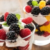Fresh fruit and yogurt partait in glass dishes.