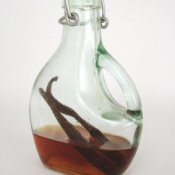 Homemade vanilla extract in a glass bottle.