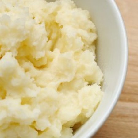 Upclose photo of mashed potatoes in a bowl.