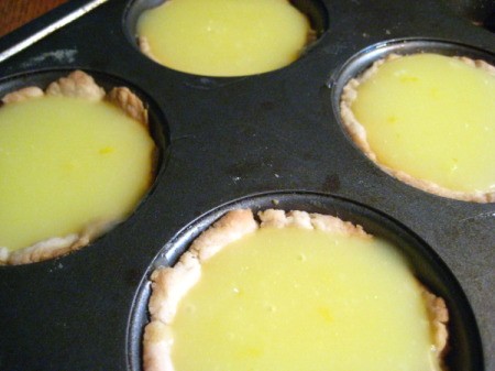 Lemon filling in baked crusts.