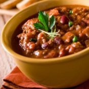 A bowl of homemade chili in a yellow bowl.