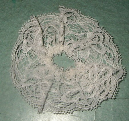 Lace after gathering with running stitch.