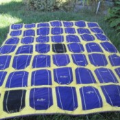 Crown Royal quilt lying on the lawn.