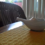 White Nedi pot on mat on table
