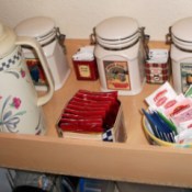 Wooden box with tea, coffee, canisters, carafe, etc.