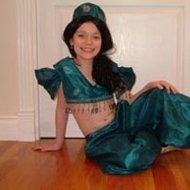 A young girl in a homemade Princess Jasmine costume.