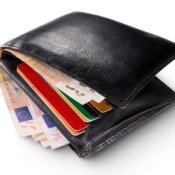 Black Wallet Stuffed With Cash and Credit Cards