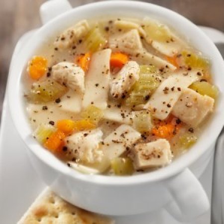 A bowl of hearty chicken noodle soup.