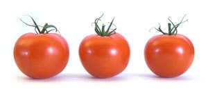 Photo of three tomatoes.