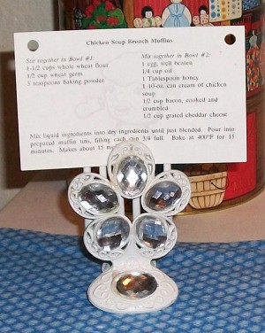 Decorative hair clip with clear faceted stones holding recipe.