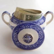 Money hidden in a china sugar pot.