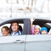 Family in Car Leaving in Winter