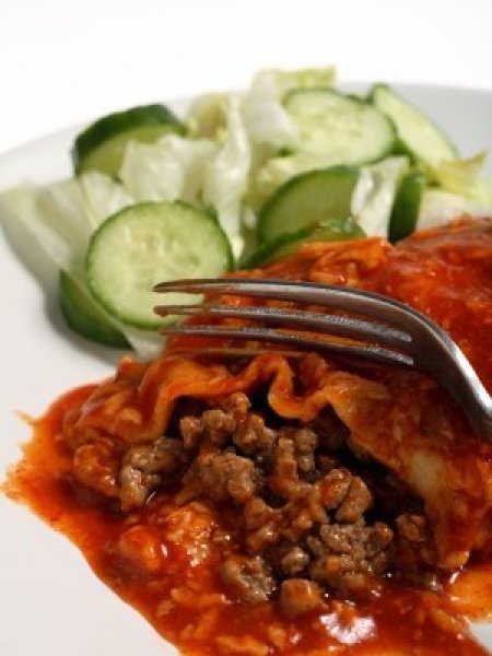 Homemade Enchilada Sauce Recipes, A red enchilada covered in sauce.